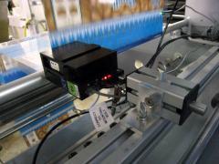 Inkjet coder printing on moving film.